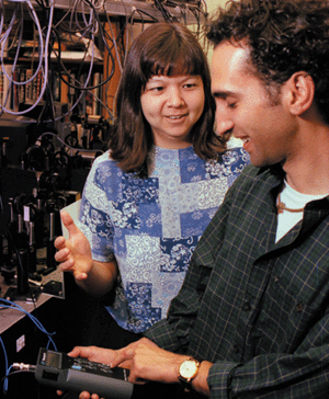 Deborah Jin with students in lab