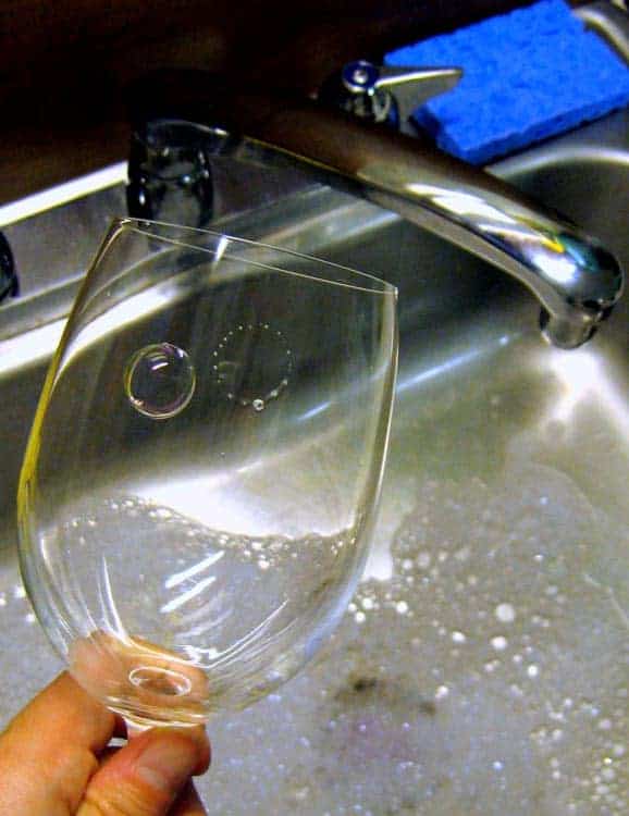 The Physics Behind the Bubble Cascade That Forms in a Glass of