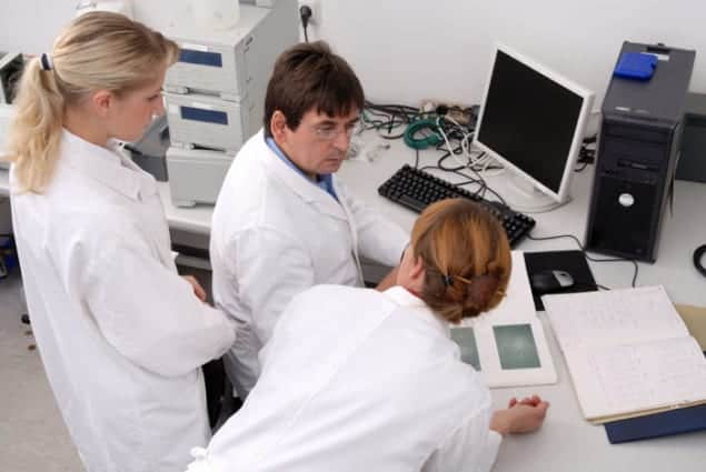 Photograph of researchers at work in a lab