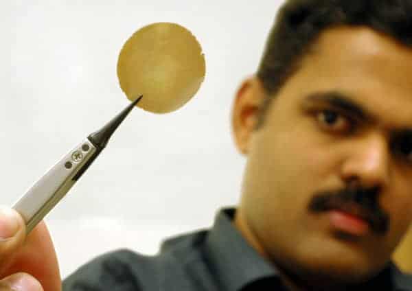 Photo of Manchester physicist Rahul Nair holding a graphene membrane