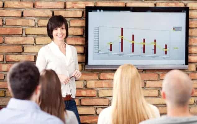 A scientist presenting data to an audience A scientist presenting data to an audience