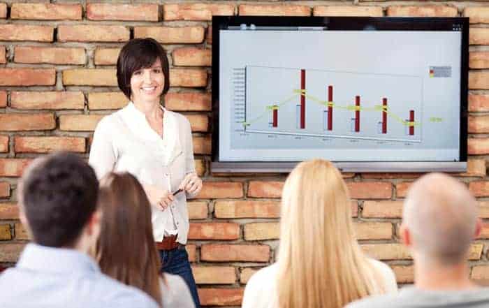 A scientist presenting data to an audience