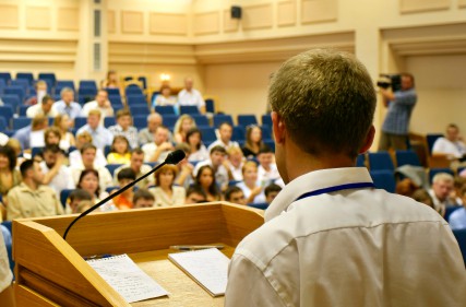 Man delivering a lecture Man delivering a lecture