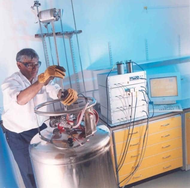 A researcher showing a cryogenic current comparator