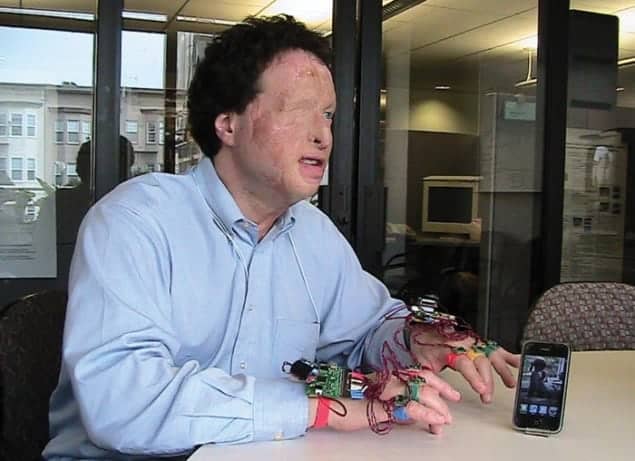 Joshua Miele using a prototype of the Wear-a-Braille device he developed