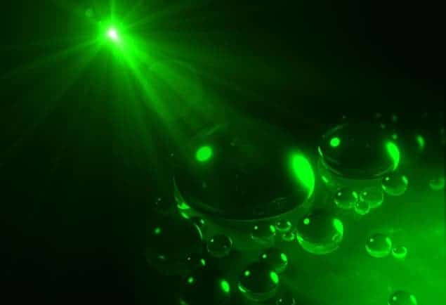 Image of oil drops in a beam of light