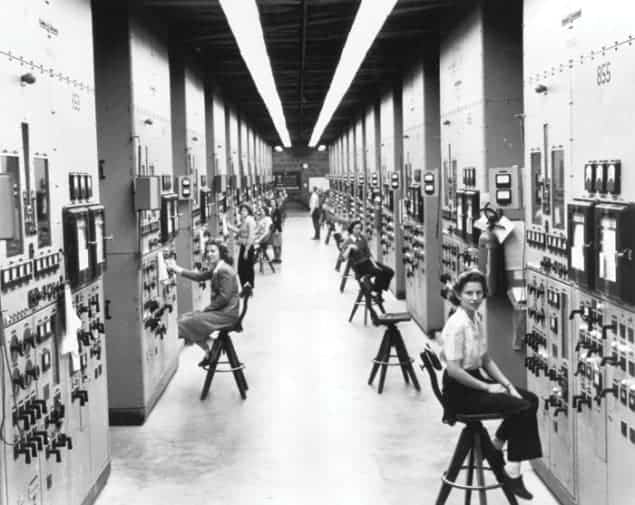 Photo of a dozen women operating calutrons at the Oak Ridge uranium-enrichment facility during the Second World War