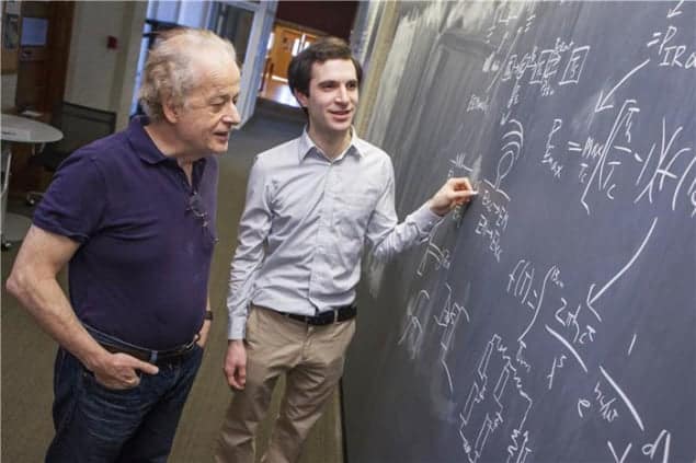 Photograph of Federico Capasso and Steven Byrnes discussing their proposal for harvesting infrared emissionsPhotograph of Federico Capasso and Steven Byrnes