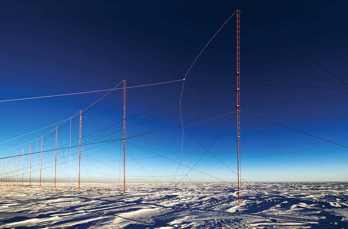 Row of large aerials in snowy landscape