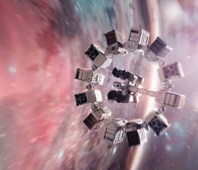 Still photo from the film Interstellar showing a spacecraft hurtling through space