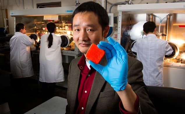 Photograph of Jinsong Huang with his new crystal for X-ray detection