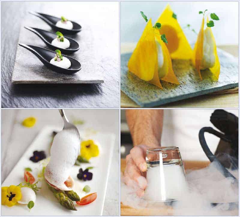 Photo of three black spoons containing spheres of white yoghurt, garnished with leaves; Photo of triangles of dried mango standing on end; Photo of a culinary foam being gently spooned onto a plate containing yellow and purple edible flowers, two spears of asparagus and thin wedges of tomato; Photo of man&rsquo;s hand holding an upturned glass that is filling up with smoke from a pipe at the bottom. Smoke swirls around the hand and glass
