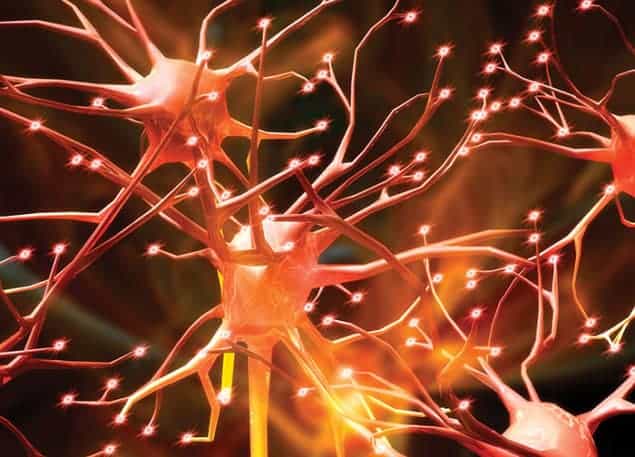 Artistic impression of a network of neurons, showing orange tendrils branching out and sparking at the ends