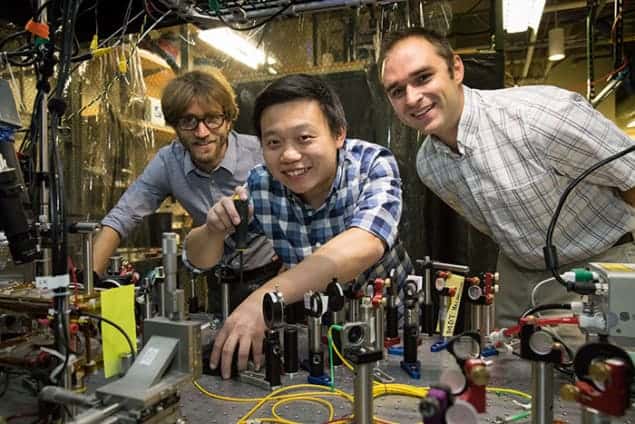 Photograph of Wesley Campbell, Xueping Long and Andrew Jayich in the lab at UCLA