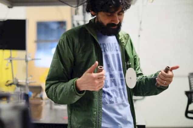 Photograph of Manu Prakash operating a paperfuge