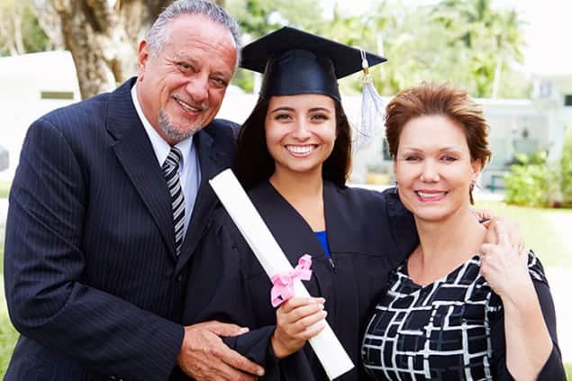 Photograph of parents and daughter at her graduation ceremony