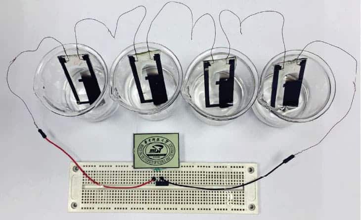 Photograph showing four devices connected in series to run a liquid-crystal display