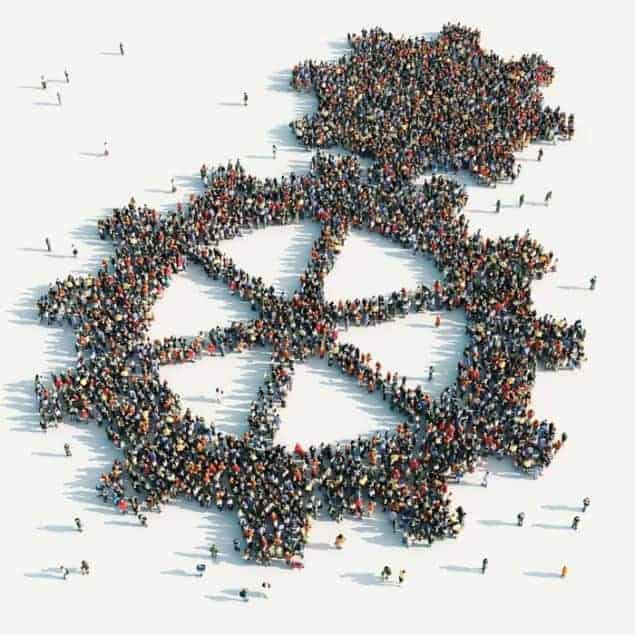 Computer-graphic aerial view of hundreds of people standing in a way that looks like two adjoined cogs