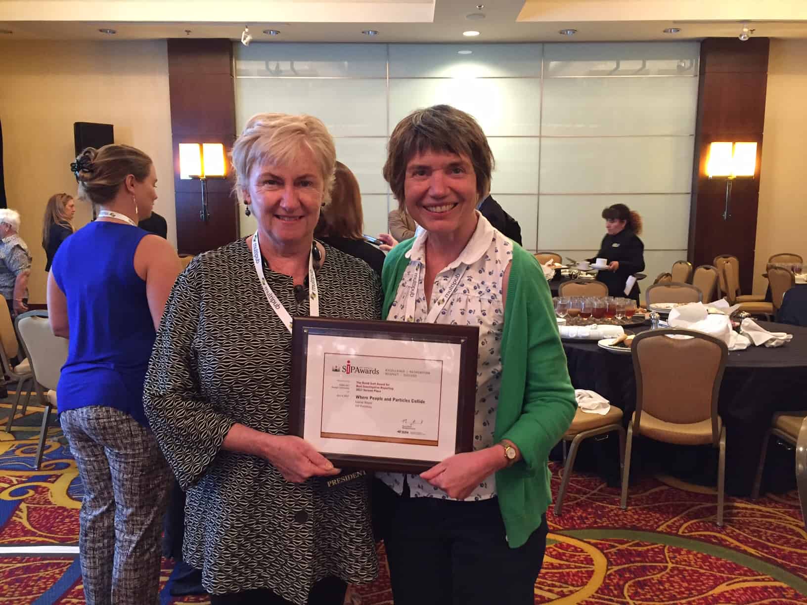 Photo of Susan Curtis from IOP Publishing with Cynthia Carter, president of the Specialised Information Publishers Association (SIPA) picking up a prize on behalf of Louise Mayor for her article "Where people and particles collide"