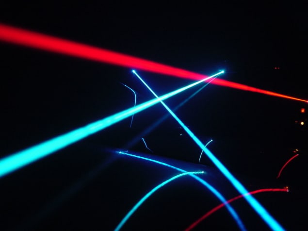 laser beams illuminate fog