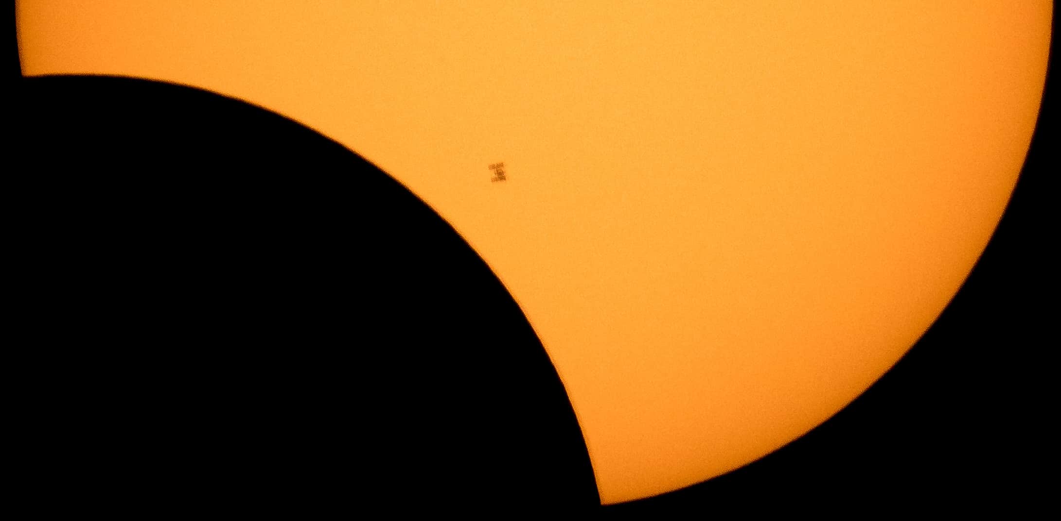 the International Space Station silhouetted against the Sun during the partial solar eclipse