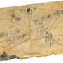Photo of a dog-eared and stained scrap of paper with numbers and sums written on it and roughly crossed out