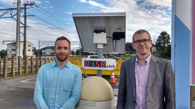 Photograph of Bruce Drinkwater and Rob Malkin by a solar-powered dose meter
