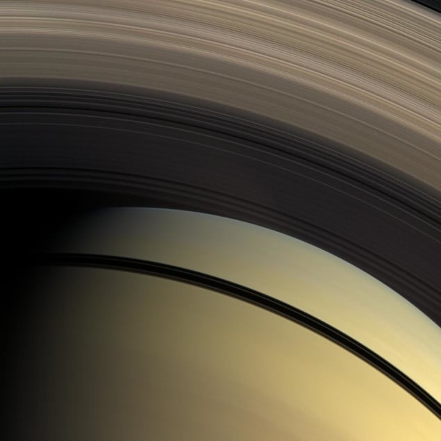 A photograph captured by the Cassini spacecraft of Saturn's rings and the shadows they cast on the planet.