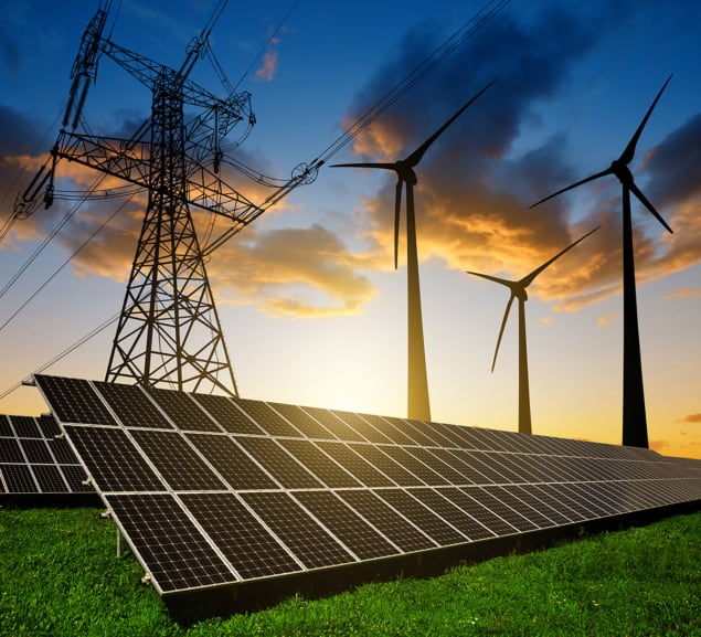 Solar panels with wind turbines and electricity pylon at sunset. Composite image of solar panels with wind turbines and electricity pylon at sunset