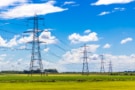 Photo of row of pylons in the English countryside. Courtesy: iStock/John Kelly