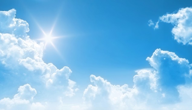 Photo of blue sky, sun and clouds