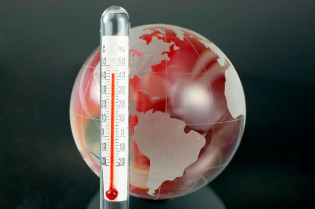Illustration of thermometer next to planet Earth