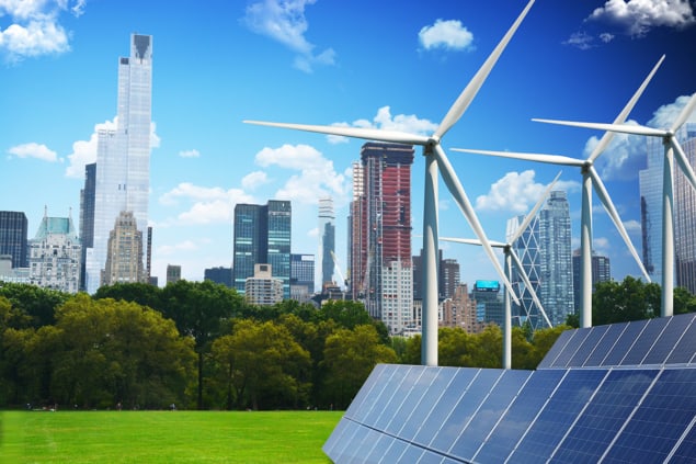 Composite photo of solar panels, wind turbines and city buildings