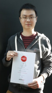 Photo of Liujun Zou from Harvard University with a certificate as the winner of the inaugural Physics World science-communication award