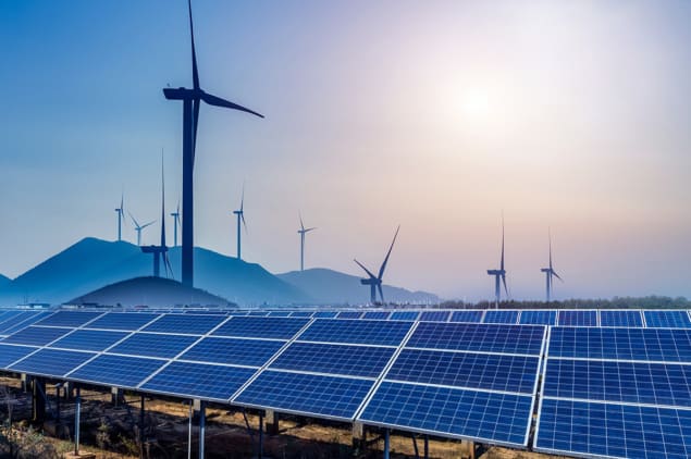 Photo of wind turbines and solar panels Photo of wind turbines and solar panels