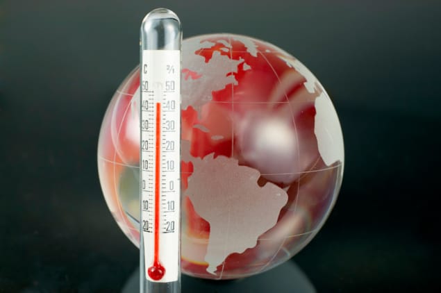 Illustration of Earth next to a thermometer Illustration of Earth next to a thermometer