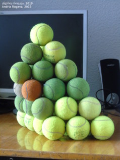 Photo of frustum pyramid made from 46 tennis balls