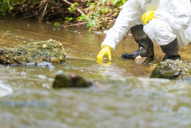 Photo of someone taking water samples