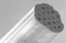 Fibre containing microspheres