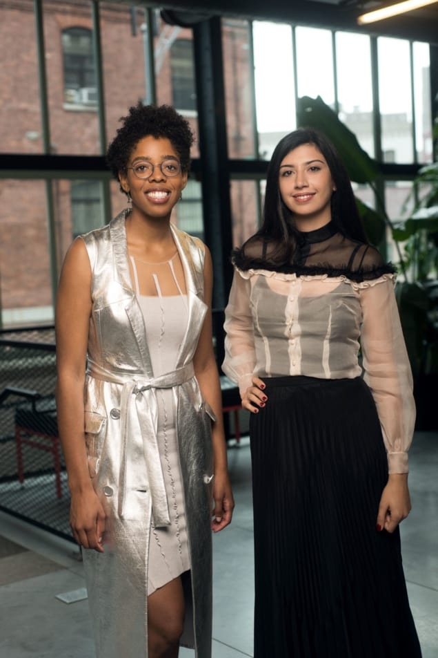 Madison Maxey and Ezgi Ucar standing in front of a window