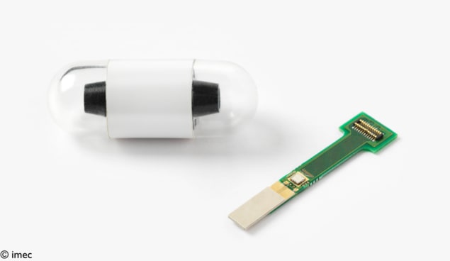 Photo of the transceiver circuit next to a rolled-up version of the circuit inside a capsule