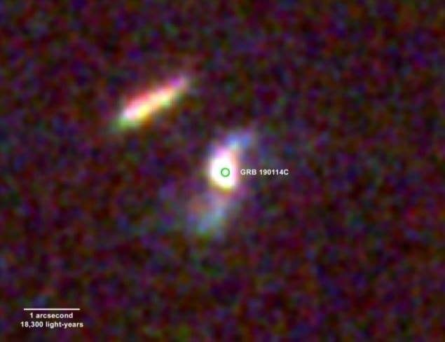 Image showing two galaxies as bright, pixellated streaks against a black background