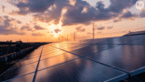 Photo of solar panels and red sky