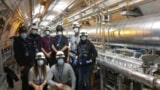 CERN scientists during installation of the last two Low-Impedance Secondary Collimators (TCSPM) in the LHC tunnel