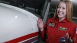 Abigail Harrison with a plane