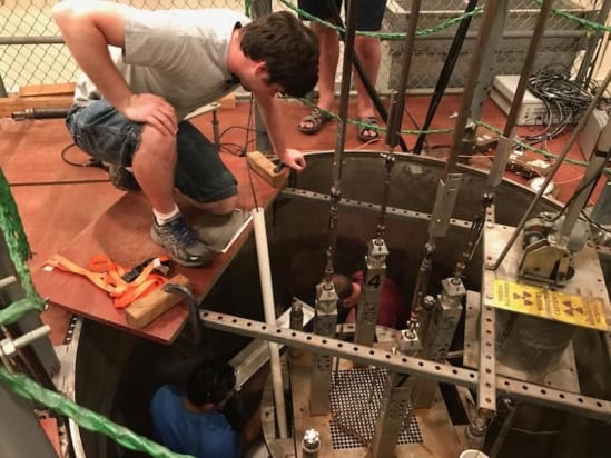 Reactor operator Nicholas Thompson of Los Alamos National Laboratory helps to set up the neutron clustering measurements at the Walthousen Reactor Critical Facility at Rensselaer Polytechnic Institute