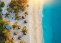 sandy beach with palm trees and the Indian Ocean in Zanzibar