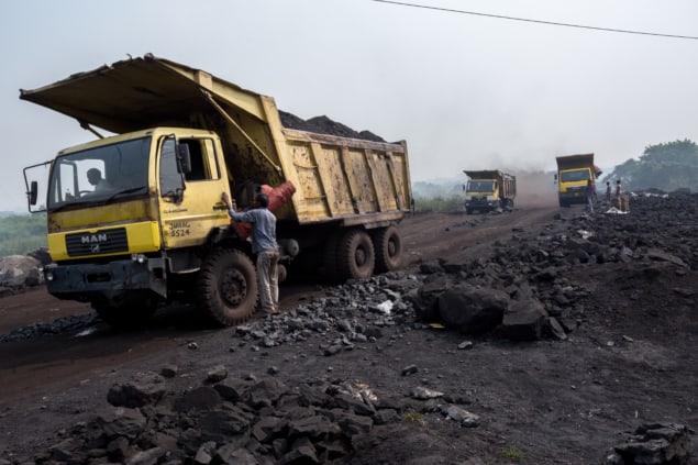 Coal being loaded onto trucks in Jharia, Dhanbad, India