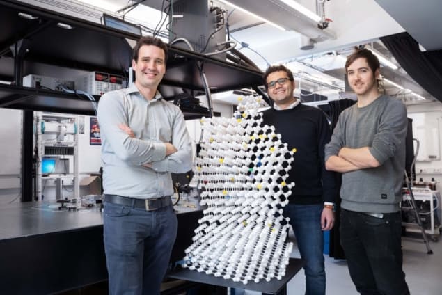 Photo of Tim Taminiau, Mohamed Abobeih and Joe Randal with a model of the diamond they used in their experiment