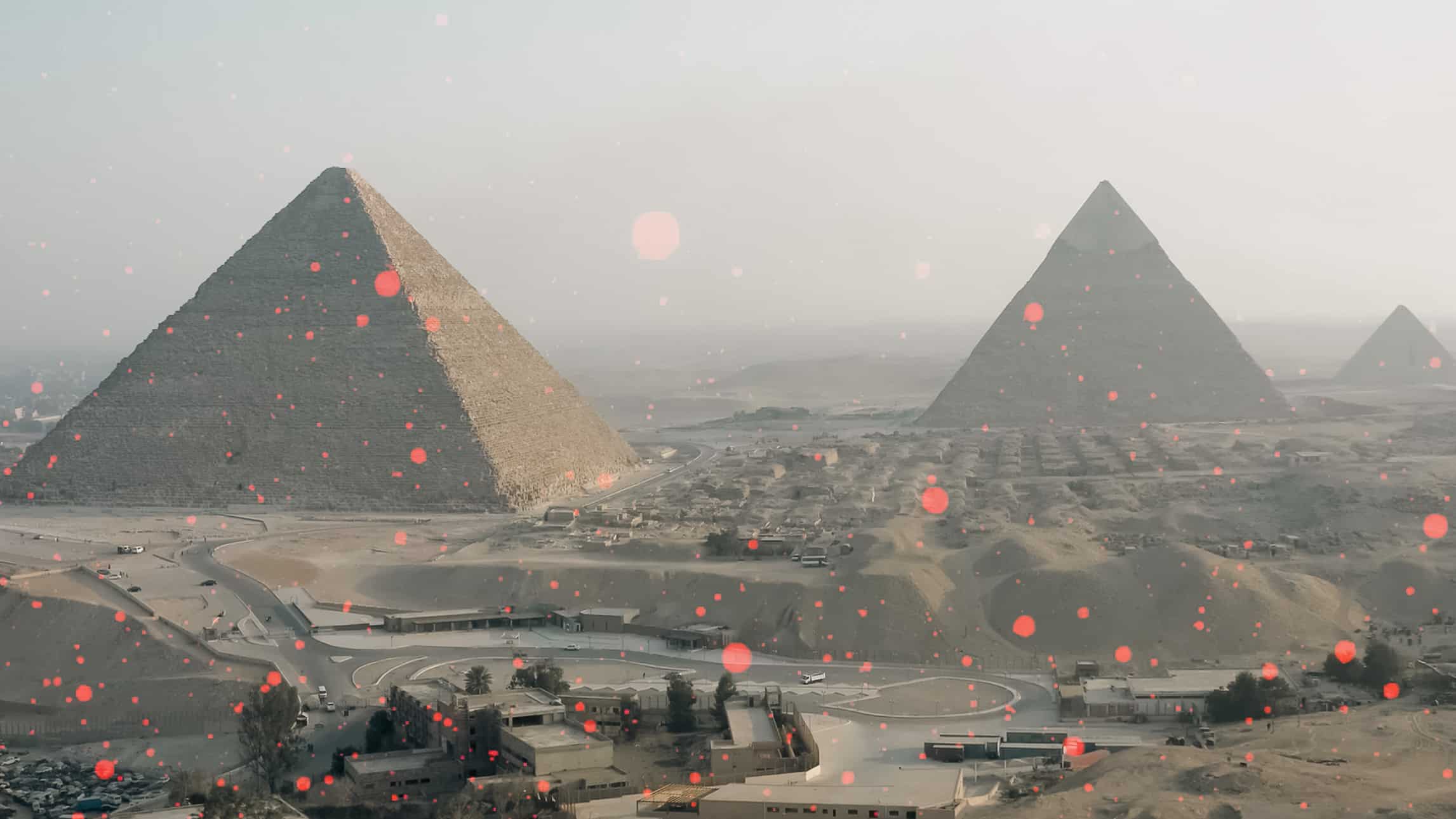 Egyptian pyramids showered in red particles